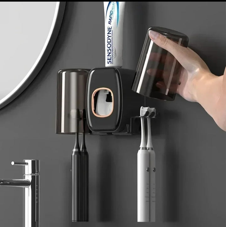 Toothpaste dispenser with toothbrush holder